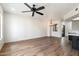 Spacious living room with hardwood floors, a modern ceiling fan, and natural light at 280 S Evergreen Rd # 1336, Tempe, AZ 85288