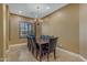 Dining room featuring a wooden table and leather upholstered chairs at 2876 E Cherrywood Pl, Chandler, AZ 85249