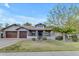 Charming home with three-car garage, stone accents, and well-maintained landscaping at 2876 E Cherrywood Pl, Chandler, AZ 85249