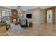 Inviting living room with a stone fireplace and arched doorway at 2876 E Cherrywood Pl, Chandler, AZ 85249