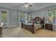 Main bedroom features a king bed, neutral walls, and natural lighting at 2876 E Cherrywood Pl, Chandler, AZ 85249