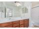 Bathroom featuring double sinks, a vanity, and an oversized mirror at 29900 N Maravilla Dr, San Tan Valley, AZ 85143