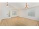 Bright living room featuring wood floors, neutral walls and lots of windows at 29900 N Maravilla Dr, San Tan Valley, AZ 85143