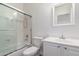 Bright bathroom featuring a shower-tub combo, a white vanity and a large mirror at 3110 E Desert Flower Ln, Phoenix, AZ 85048