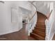 Grand foyer showcasing a winding staircase and view of the cozy living room at 3110 E Desert Flower Ln, Phoenix, AZ 85048