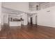 Bright, open living room with hardwood floors flowing into kitchen and featuring a beautiful second story balcony at 3110 E Desert Flower Ln, Phoenix, AZ 85048