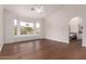 Spacious main bedroom featuring hardwood floors, vaulted ceilings, and large windows with scenic views at 3110 E Desert Flower Ln, Phoenix, AZ 85048