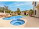 Inviting pool and spa combination with natural rock water feature at 3110 E Desert Flower Ln, Phoenix, AZ 85048