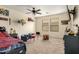 Comfortable bedroom with neutral walls, ceiling fan, carpeted floor and playful décor that creates an inviting atmosphere at 3126 W Apollo Rd, Phoenix, AZ 85041