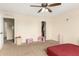 Bright bedroom with carpet, ceiling fan, and natural light at 3126 W Apollo Rd, Phoenix, AZ 85041