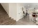 Hallway view featuring a carpeted staircase and hardwood flooring with glimpses of an adjacent room at 3126 W Apollo Rd, Phoenix, AZ 85041