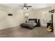 Cozy main bedroom features a ceiling fan and access to the outdoor area at 3126 W Apollo Rd, Phoenix, AZ 85041