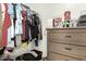 Walk-in closet featuring custom organizers and a variety of clothing and accessories at 3126 W Apollo Rd, Phoenix, AZ 85041