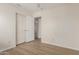 This room has wood look floors, double door closet, and ceiling fan at 3363 W Lone Cactus Dr, Phoenix, AZ 85027