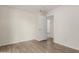 Empty bedroom with wood look floors, neutral color paint, and ceiling fan at 3363 W Lone Cactus Dr, Phoenix, AZ 85027