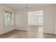 Bright living room with light wood floors and natural light streaming through shuttered windows at 3363 W Lone Cactus Dr, Phoenix, AZ 85027