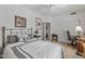 Bedroom with a neutral color scheme, ceiling fan and a work area with desk and chair at 3801 N 154Th Ln, Goodyear, AZ 85395