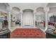 Elegant foyer with arched columns, tile flooring, and an inviting view into the living spaces at 3801 N 154Th Ln, Goodyear, AZ 85395