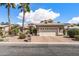 Charming single-Gathering home with desert landscaping, a three-car garage, and a tile roof at 3801 N 154Th Ln, Goodyear, AZ 85395