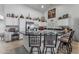 Spacious kitchen with a large island, black countertops, white cabinets, and modern stainless steel appliances at 3801 N 154Th Ln, Goodyear, AZ 85395