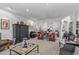 Spacious living room featuring classic furnishings, neutral carpet, and views into the dining area at 3801 N 154Th Ln, Goodyear, AZ 85395