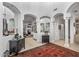 Elegant living room featuring arched entryways, neutral tones, and ample natural light at 3801 N 154Th Ln, Goodyear, AZ 85395