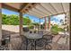 Enjoy outdoor living under this covered patio with a view of the well-maintained backyard at 3801 N 154Th Ln, Goodyear, AZ 85395