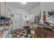 Messy, cluttered room with boxes and items covering the floor and countertops at 3801 N 154Th Ln, Goodyear, AZ 85395