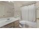 Bathroom includes a vanity, toilet, mirror, and a bathtub with shower at 4622 E Fairbrook Cir, Mesa, AZ 85205