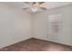 Bedroom features wood-look flooring, a ceiling fan, and a window at 4622 E Fairbrook Cir, Mesa, AZ 85205