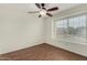 Bedroom features wood-look flooring, a ceiling fan, and a window at 4622 E Fairbrook Cir, Mesa, AZ 85205