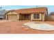 Charming single-story home with a well-manicured desert landscape and a red tile roof at 4622 E Fairbrook Cir, Mesa, AZ 85205