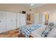 Bedroom with high ceilings, neutral paint, tiled flooring, closet and connecting bath at 4728 E Swilling Rd, Phoenix, AZ 85050