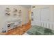 Bright bedroom boasts Saltillo tile, floating shelves, and a piano for a creative and inviting space at 4728 E Swilling Rd, Phoenix, AZ 85050