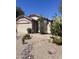 Charming desert landscaping with cacti and rock accents in this home's front yard at 4728 E Swilling Rd, Phoenix, AZ 85050