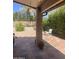 Covered patio with tile flooring and views of the landscaped backyard at 4728 E Swilling Rd, Phoenix, AZ 85050