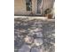 Stone pathway leading to the front door of a home with desert landscaping at 4728 E Swilling Rd, Phoenix, AZ 85050