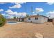 Wide backyard showcasing the home's layout, covered patio and cozy pool, complete with desert landscape at 5716 W Hazelwood St, Phoenix, AZ 85031