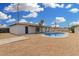 An expansive backyard with a refreshing pool, offering ample space for outdoor relaxation and entertainment at 5716 W Hazelwood St, Phoenix, AZ 85031