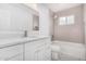 Bathroom features a tub, shower, and a designer tile floor at 5716 W Hazelwood St, Phoenix, AZ 85031