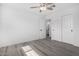 Bedroom features closet with sliding doors and neutral gray flooring at 5716 W Hazelwood St, Phoenix, AZ 85031