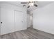 Bedroom features closet with sliding doors and neutral gray flooring at 5716 W Hazelwood St, Phoenix, AZ 85031