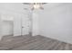 Bedroom features closet with sliding doors and neutral gray flooring at 5716 W Hazelwood St, Phoenix, AZ 85031