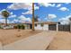 Exterior showing landscaping, single car garage, and charming facade at 5716 W Hazelwood St, Phoenix, AZ 85031