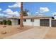 Exterior showing landscaping, single car garage, and charming facade at 5716 W Hazelwood St, Phoenix, AZ 85031