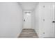 Bright hallway featuring wood-look floors and a decorative glass front door at 5716 W Hazelwood St, Phoenix, AZ 85031