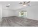 Living room features sliding glass doors leading to a pool area for seamless indoor/outdoor living at 5716 W Hazelwood St, Phoenix, AZ 85031