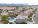 An aerial shot of a home with a private pool, lush landscaping, and mountain views in the background at 6221 S 45Th Gln, Laveen, AZ 85339