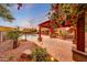 Exterior view of patio and pool area with gazebo and mature trees, perfect for outdoor gatherings at 6221 S 45Th Gln, Laveen, AZ 85339