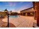 An amazing backyard with a large pool, decorative lighting, and outdoor living space at 6221 S 45Th Gln, Laveen, AZ 85339